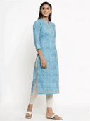 Woman wearing a grey indian kurti for women by Nishtha Chadda