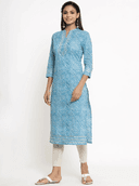 Woman wearing a grey indian kurti for women by Nishtha Chadda