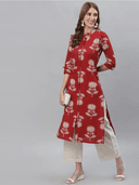 Woman wearing a red indian kurti for women by Nishtha Chadda
