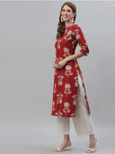 Woman wearing a red indian kurti for women by Nishtha Chadda