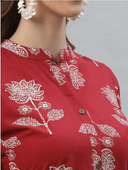 Woman wearing a red indian kurti for women by Nishtha Chadda