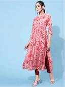 Woman wearing a red indian kurti for women by Nishtha Chadda