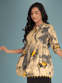 Woman wearing a grey indian kurti for women by Nishtha Chadda