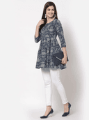Woman wearing a grey indian kurti for women by Nishtha Chadda