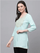 Woman wearing a grey indian kurti for women by Nishtha Chadda