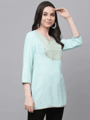 Woman wearing a grey indian kurti for women by Nishtha Chadda