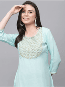 Woman wearing a grey indian kurti for women by Nishtha Chadda