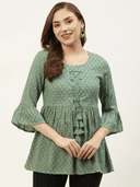 Woman wearing a olive indian kurti for women by Nishtha Chadda