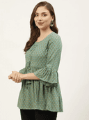 Woman wearing a olive indian kurti for women by Nishtha Chadda