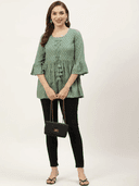 Woman wearing a olive indian kurti for women by Nishtha Chadda