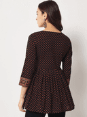Woman wearing a brown indian kurti for women by Nishtha Chadda
