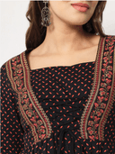 Woman wearing a brown indian kurti for women by Nishtha Chadda