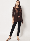 Woman wearing a brown indian kurti for women by Nishtha Chadda