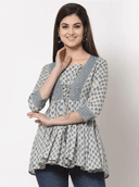 Woman wearing a grey indian kurti for women by Nishtha Chadda