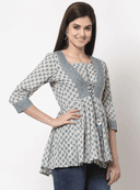 Woman wearing a grey indian kurti for women by Nishtha Chadda