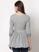 Woman wearing a grey indian kurti for women by Nishtha Chadda
