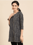 Woman wearing a grey indian kurti for women by Nishtha Chadda