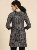 Woman wearing a grey indian kurti for women by Nishtha Chadda