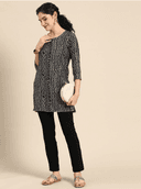 Woman wearing a grey indian kurti for women by Nishtha Chadda