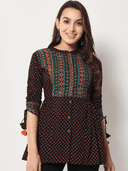 Woman wearing a brown indian kurti for women by Nishtha Chadda