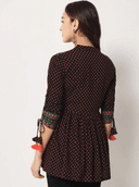 Woman wearing a brown indian kurti for women by Nishtha Chadda