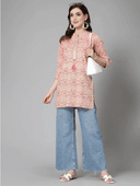 Woman wearing a grey indian kurti for women by Nishtha Chadda