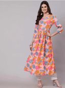 Woman wearing a coral indian kurti for women by Nishtha Chadda