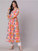 Woman wearing a coral indian kurti for women by Nishtha Chadda