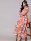 Woman wearing a coral indian kurti for women by Nishtha Chadda