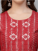 Woman wearing a red indian kurti for women by Nishtha Chadda
