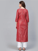 Woman wearing a red indian kurti for women by Nishtha Chadda