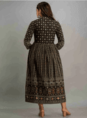 Woman wearing a maroon indian kurti for women by Nishtha Chadda