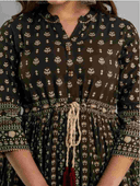 Woman wearing a maroon indian kurti for women by Nishtha Chadda