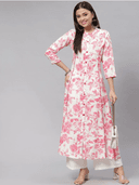 Woman wearing a beige cotton tunic for women by Nishtha Chadda