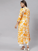 Woman wearing a mustard indian kurti for women by Nishtha Chadda