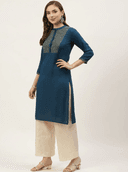 Woman wearing a navy indian kurti for women by Nishtha Chadda