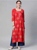 Woman wearing a red indian kurti for women by Nishtha Chadda