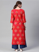 Woman wearing a red indian kurti for women by Nishtha Chadda