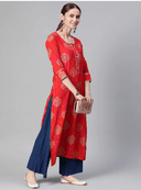 Woman wearing a red indian kurti for women by Nishtha Chadda