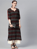 Woman wearing a brown indian kurti for women by Nishtha Chadda