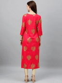 Woman wearing a red indian kurti for women by Nishtha Chadda