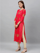 Woman wearing a red indian kurti for women by Nishtha Chadda