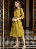 Woman wearing a mustard indian kurti for women by Nishtha Chadda