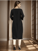Woman wearing a maroon indian kurti for women by Nishtha Chadda