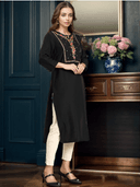 Woman wearing a maroon indian kurti for women by Nishtha Chadda