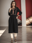 Woman wearing a maroon indian kurti for women by Nishtha Chadda