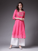 Woman wearing a pink cotton tunic for women by Nishtha Chadda