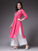 Woman wearing a pink cotton tunic for women by Nishtha Chadda