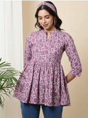 Woman wearing a brown indian kurti for women by Nishtha Chadda