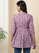 Woman wearing a brown indian kurti for women by Nishtha Chadda